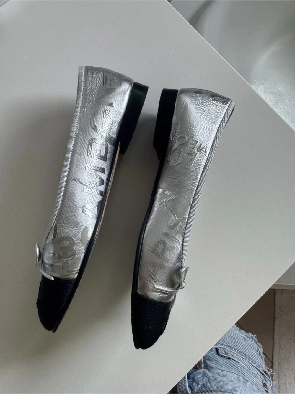 CHANEL Silver Leather Ballerina Flats with Black Cap Toe